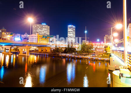 Milwaukee River, downtown buildings and busy interstate highway at night Stock Photo