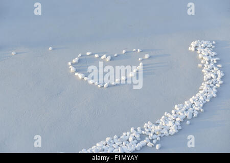 Close up of white stones, pebbles with heart,wedding entrance Stock Photo