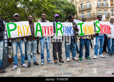 Paris, France. Demonstration Rally, in Solidarity with African Immigrants, Migrants, Camped on Makshift Camps on Street, Group Holding Signs, 'P.A.R.I.S.' (Peace, Love, Reunited, Total Satisfaction' social justice slogans, refugees men, black community Paris, peaceful protest sign Stock Photo