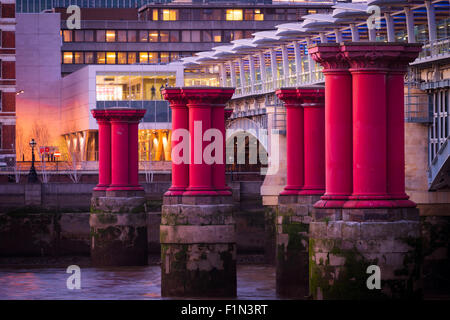 A close up of the purple pillars running alongside Blackfriars bridge in London Stock Photo