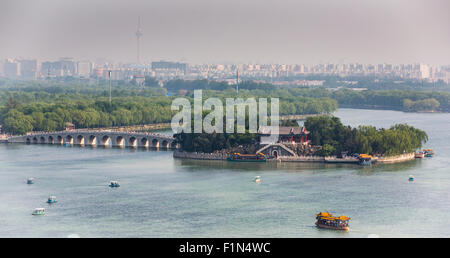 Nanhu (South Lake) Island , seventeeen-arch bridge, South Lake, and Beijing skyline from Longevity Hill, Summer Palace, Beijing Stock Photo