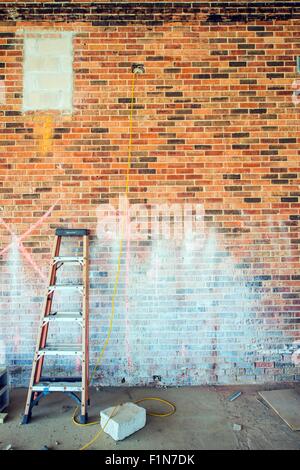Ladder at Construction Site. Brick Wall. Construction Concept. Stock Photo