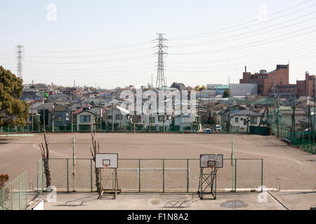 Japanese Junior High School dirt playground field and basketball courts Stock Photo