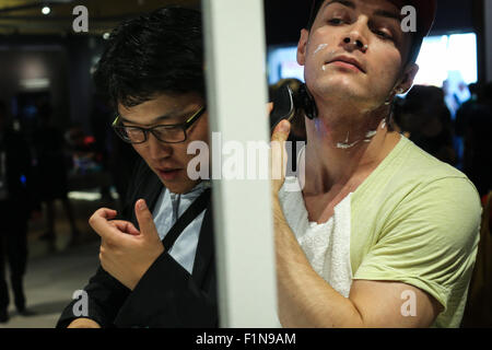 Berlin, Germany. 4th Sep, 2015. Visitors try electric shavers at Philip's stand of the 55th IFA consumer electronics fair in Berlin, Germany, on Sept. 4, 2015. As the 55th IFA consumer electronics fair, Europe's largest consumer electronics and home appliances fair kicked off on Friday in Berlin, China Brand Show also held its first opening ceremony at IFA. Credit:  Zhang Fan/Xinhua/Alamy Live News Stock Photo