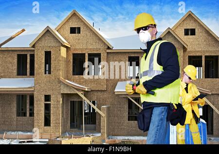 Building Construction Site with Two Contractor. One Contractor Site Manager with Tablet and Second Contractor with Small Hammer. Stock Photo