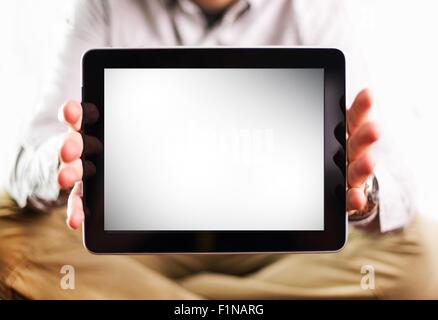 Men Showing Tablet Screen - Blank White Display. Young Male with Elegant Tablet Computer. Computer Technology Photography Stock Photo
