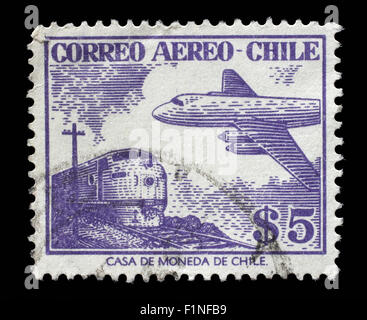 Stamp printed in Chile shows plane on the background of train, circa 1950s Stock Photo