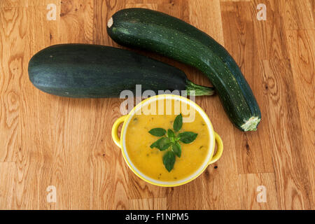 Cream of zucchini soup with basil Stock Photo
