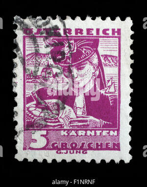 Stamp printed in the Austria shows Woman from Carinthia, Regional Costume, circa 1934 Stock Photo