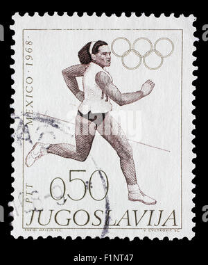 Stamp printed in Yugoslavia shows Running, Olympic games in Mexico City, circa 1968 Stock Photo