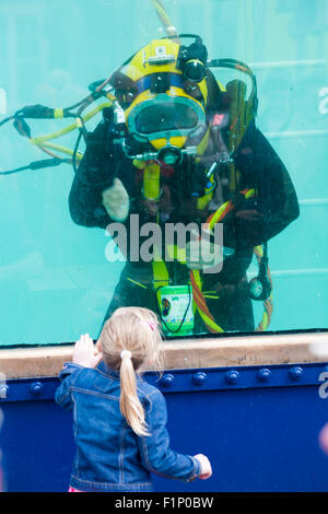 Weymouth, Dorset, UK. 5 September 2015. Crowds attend the Waterfest festival in Weymouth. Children interact with the divers in the Underwater Zone as the Royal Navy demonstrate their skills underwater in the dive tank Credit:  Carolyn Jenkins/Alamy Live News Stock Photo