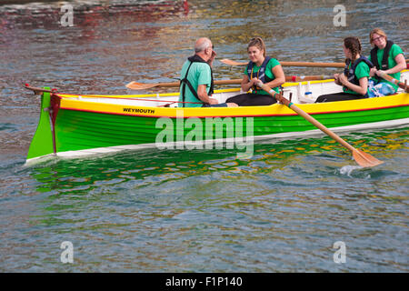 Weymouth, Dorset, UK. 5 September 2015. Crowds attend the Waterfest festival in Weymouth. Weymouth Gig Rowing Club the first stage race up the harbour Credit:  Carolyn Jenkins/Alamy Live News Stock Photo