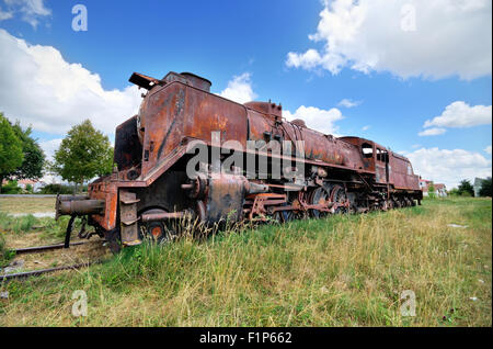 Scenic HDR image of an old ruined locomotive. Stock Photo