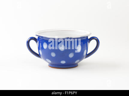 white and blue tea cup with dots on white background Stock Photo