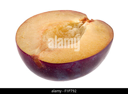 Plum fruit slice closeup isolated on white Stock Photo