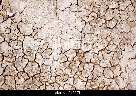 Cracked Soil Photo Background. Badlands Cracked Dry Lands Stock Photo