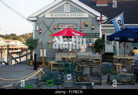 Lobster traps drying in front of a seafood restaurant on the harbor in Boothbay, Maine. Stock Photo