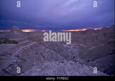 Electric Storm Over Badlands - Lightning Strikes on the Horizon. Badlands National Park, South Dakota, U.S.A. Weather Photograph Stock Photo