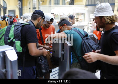 Greece. 05th Sep, 2015. Refugees put their metro tickets into the barrier. Thousands of migrants from Syria, Iraq and Afghanistan come to Athens on a near daily basis from the Greek islands which they reached from Turkey. For many of these refugees, Athens is just a stopover on their journey to northern European countries. Credit:  Michael Debets/Pacific Press/Alamy Live News Stock Photo