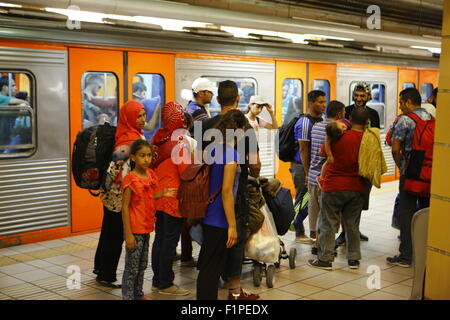 Greece. 05th Sep, 2015. Refugees stand in a Metro station in central Athens, waiting for the next train to bring them to their next station in their journey. Thousands of migrants from Syria, Iraq and Afghanistan come to Athens on a near daily basis from the Greek islands which they reached from Turkey. For many of these refugees, Athens is just a stopover on their journey to northern European countries. Credit:  Michael Debets/Pacific Press/Alamy Live News Stock Photo