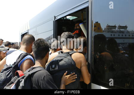Greece. 05th Sep, 2015. Migrants trying to get onto the already overcrowded bus that will bring them to Piraeus train station for further transport into Athens. Thousands of migrants from Syria, Iraq and Afghanistan come to Athens on a near daily basis from the Greek islands which they reached from Turkey. For many of these refugees, Athens is just a stopover on their journey to northern European countries. Credit:  Michael Debets/Pacific Press/Alamy Live News Stock Photo
