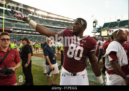 Penn State players celebrate after a win over Ohio State in an NCAA