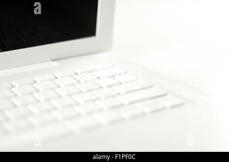 White Laptop Computer on the White Background. Stock Photo