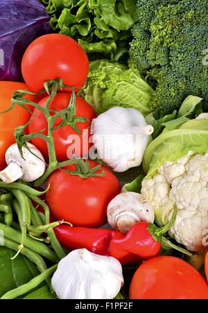 Vegetables Vertical Photo. Multi Vegetables Composition. Tomatoes, Garlic, Greens, Mushrooms and Broccoli. Vegetables Vertical P Stock Photo