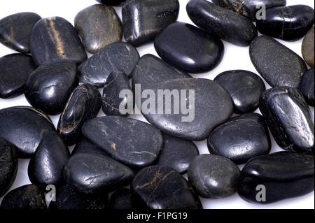 Black Rocks - White Background. Rocky Background Stock Photo