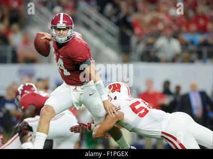 Arlington, Texas, USA. 5th September, 2015. Alabama Crimson Tide quarterback Jake Coker #14 scrambles but is brought down by Wisconsin Badgers linebacker Joe Schobert #58 in an NCAA Advocate Classic Football game between the Wisconsin Badgers and the Alabama Crimson Tide at AT&T Stadium in Arlington, TX       Albert Pena/CSM Credit:  Cal Sport Media/Alamy Live News Stock Photo