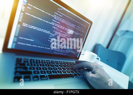 Modern Website Building Concept Photo. Working Web Programmer. Website HTML Code on a Display. Stock Photo