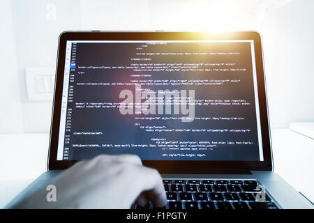 Website Programming Concept. Working Programmer Reviewing HTML Website Code. Internet Technologies. Stock Photo