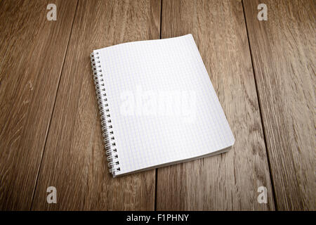 white notebook paper on  wood table Stock Photo