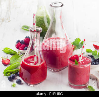Healthy fruits and vegetables smoothies in glass bottles. Selective focus Stock Photo