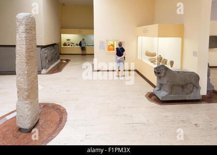 A woman views The Kadesh Treaty.  The worlds first peace treaty on display inside the Museum of the Orient, the Archeology Museum in Istanbul Turkey Stock Photo