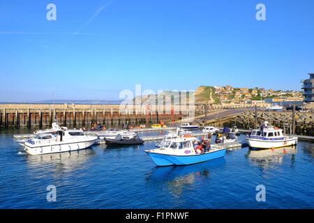 West Bay, Dorset, UK. 6th September, 2015. Blue sky and sunshine in West Bay Harbour as Dorset's Jurassic Coast enjoys a late summers day. Credit:  Tom Corban/Alamy Live News Stock Photo