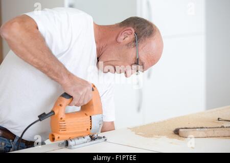Carpenter working on a project Stock Photo