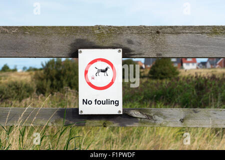 'No Fouling' (by dogs) sign on a fence in a nature reserve in Fleetwood, Lancashire Stock Photo