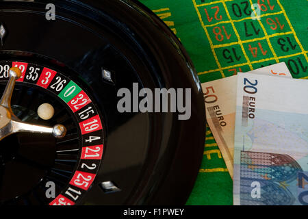 Roulette and money, gambling and losing Stock Photo