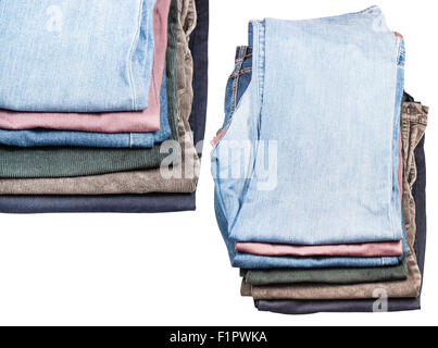 set of stacks of various jeans and corduroys isolated on white background Stock Photo