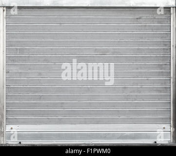 Gray metal garage gate with rolling shutters, background texture Stock Photo