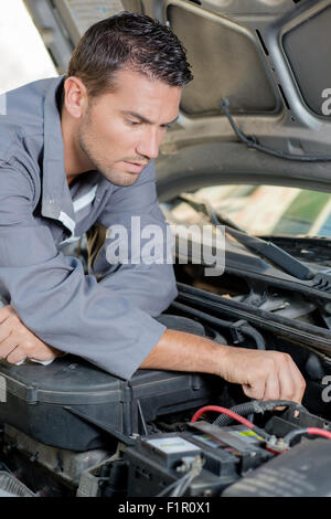 mechanic working on engine Stock Photo