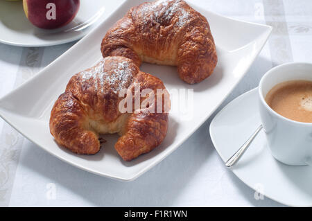 Continental breakfast with coffee , croissants and fresh fruit Stock Photo
