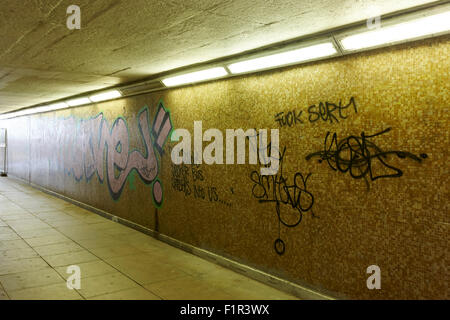 graffiti tags in underground empty walkway Birmingham UK Stock Photo