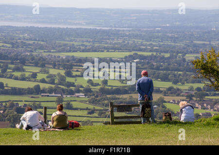 Gloucestershire, UK. 6th September, 2015. Visitors bask in the unseasonably warm September weather at a popular picnic site, Coaley Peak  overlooking the Severn Vale and river Severn in Gloucestershire. Credit:  Wayne Farrell/Alamy Live News Stock Photo