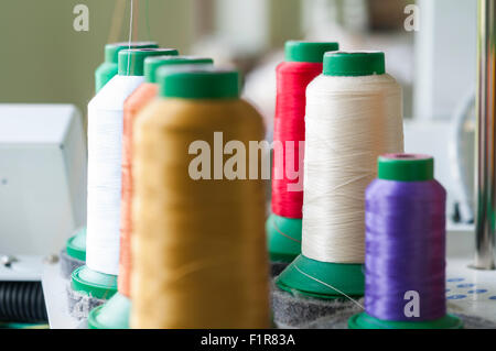 Sewing threads multicolored background closeup with shallow depth of field Stock Photo
