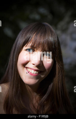 An attractive young brunette woman smiling Stock Photo