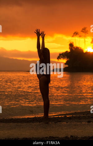 Yoga by the ocean Stock Photo