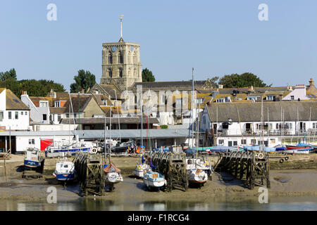 View of the Church at Shoreham on Sea West Sussex looking across the river Adur. Boat yard and boats in the foreground. Stock Photo