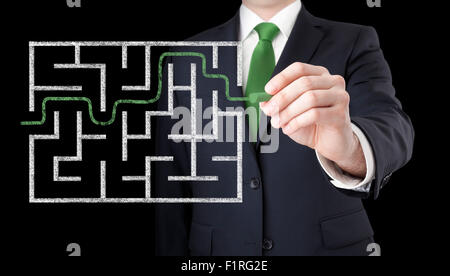 Businessman finding the solution of a maze Stock Photo